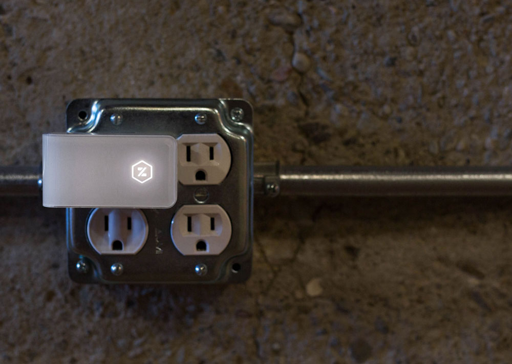 Zuli smart plug, plugged into wall outlet